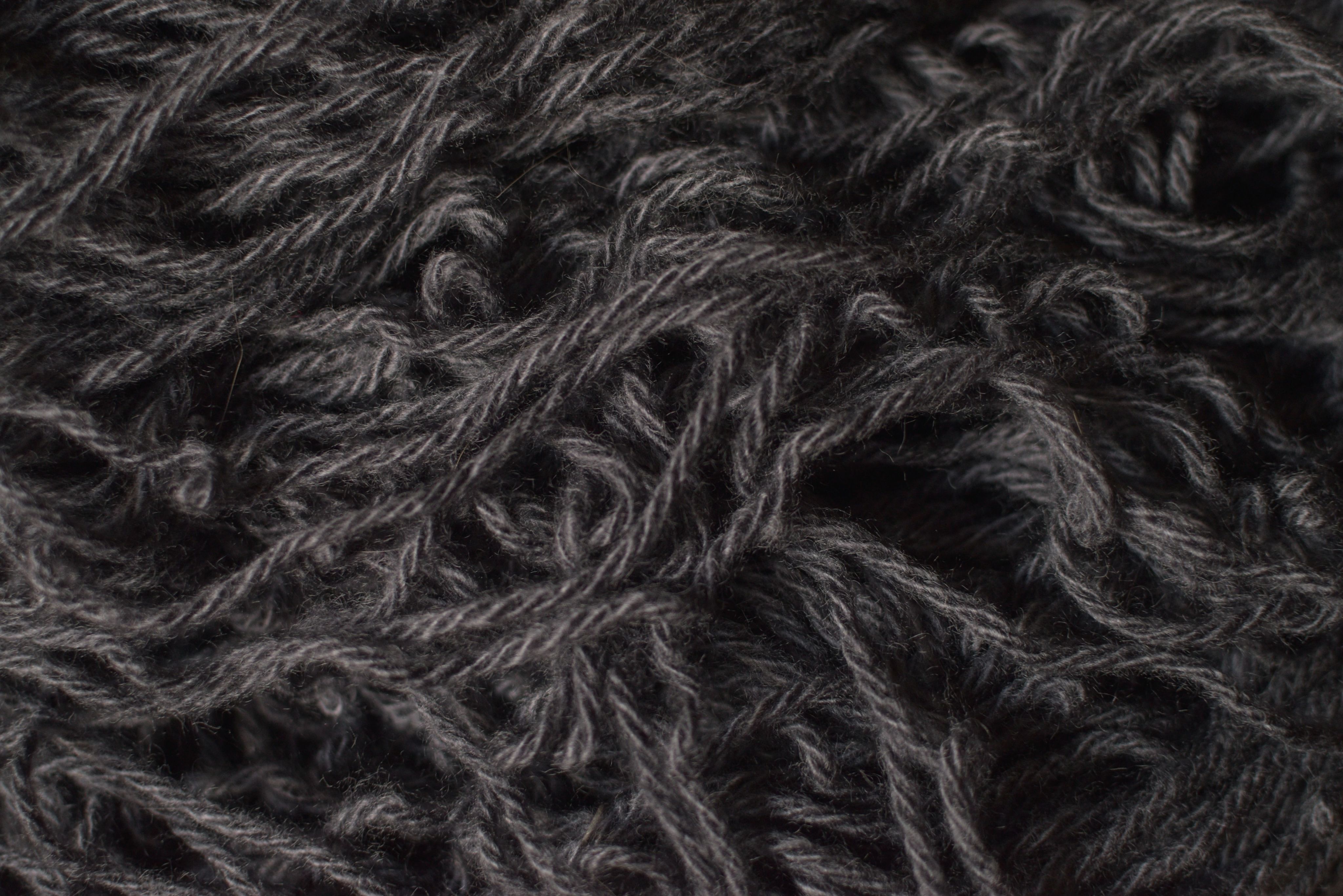 black textile on white textile